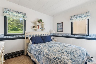 Discover the perfect lake retreat with this charming cabin on - photo 21