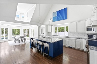 This meticulously renovated waterfront Cape on the bay is - photo 12