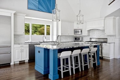 This meticulously renovated waterfront Cape on the bay is - photo 15