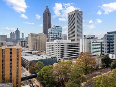 Better than new, this top-floor Midtown residence impresses with