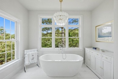 This meticulously renovated waterfront Cape on the bay is - photo 28