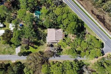 Discover the charm of Old Florida living in this 1994 stilt home - photo 29