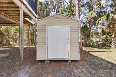 Discover the charm of Old Florida living in this 1994 stilt home - photo 32