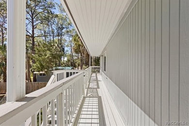 Discover the charm of Old Florida living in this 1994 stilt home - photo 33