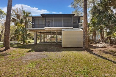 Discover the charm of Old Florida living in this 1994 stilt home - photo 39