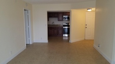 This updated ground floor unit features closed in porch; - photo 4