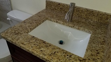 This updated ground floor unit features closed in porch; - photo 10