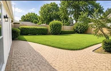 Nestled on a beautifully landscaped corner lot in the - photo 13