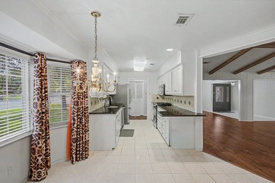 Nestled on a beautifully landscaped corner lot in the - photo 14