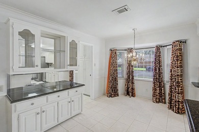 Nestled on a beautifully landscaped corner lot in the - photo 18