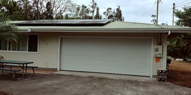Well-maintained home with gated entry, rock walls, and a paved - photo 3