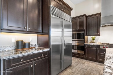 Nestled on a premium golf course lot within the exclusive gated - photo 9