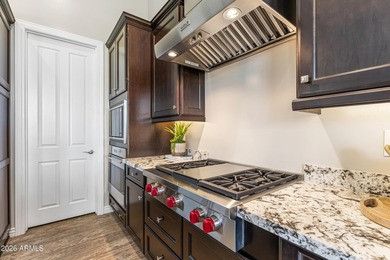Nestled on a premium golf course lot within the exclusive gated - photo 10
