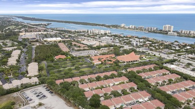 Nestled in the highly sought after Tequesta Oaks community, this - photo 1