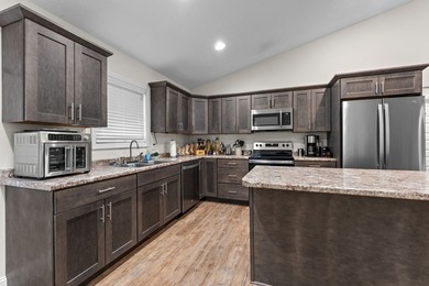 In town convenience with the comfort of main level living awaits