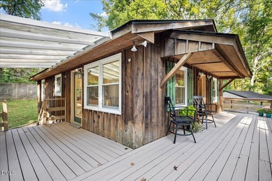 Set on a stunning, private one-acre lot, this three-bedroom