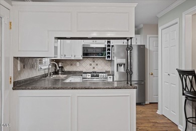 Set on a stunning, private one-acre lot, this three-bedroom