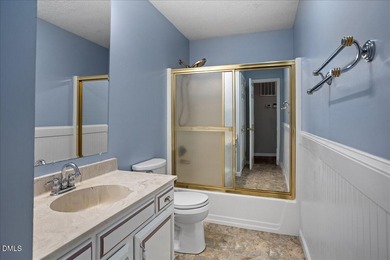 Set on a stunning, private one-acre lot, this three-bedroom