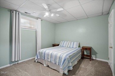 Set on a stunning, private one-acre lot, this three-bedroom