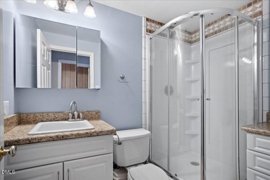 Set on a stunning, private one-acre lot, this three-bedroom