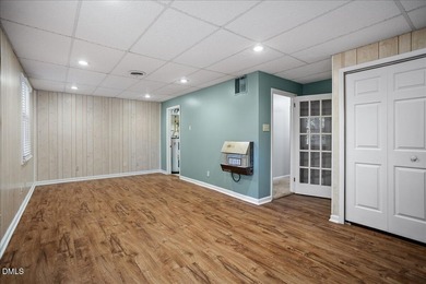 Set on a stunning, private one-acre lot, this three-bedroom