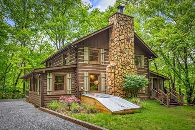 Tucked away on 3.3 acres of private, wooded serenity along 550 - photo 1