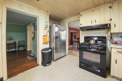 This spacious POOL home is positioned on NEARLY AN ACRE in the - photo 11
