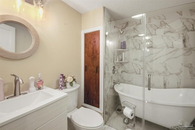 This spacious POOL home is positioned on NEARLY AN ACRE in the - photo 16