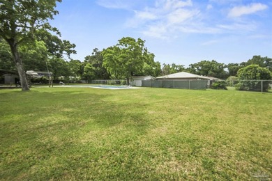 This spacious POOL home is positioned on NEARLY AN ACRE in the - photo 21