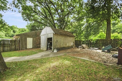 This spacious POOL home is positioned on NEARLY AN ACRE in the - photo 23