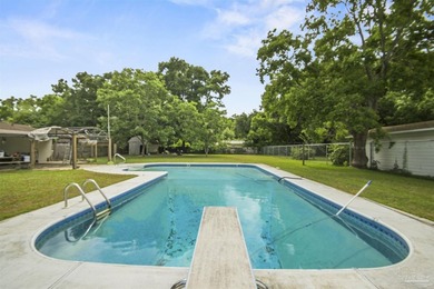 This spacious POOL home is positioned on NEARLY AN ACRE in the - photo 24