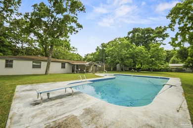 This spacious POOL home is positioned on NEARLY AN ACRE in the - photo 25
