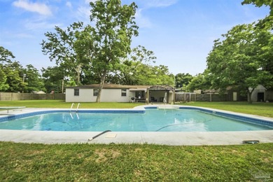 This spacious POOL home is positioned on NEARLY AN ACRE in the - photo 26