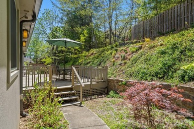 Tucked away among beautiful blooming perennials in Asheville's - photo 24