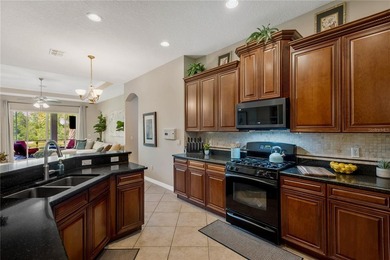 Welcome to this exceptional residence nestled within the highly - photo 3