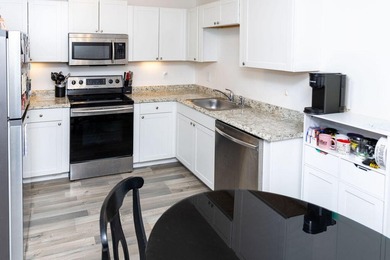 This charming home features updated kitchen and bathrooms with - photo 5