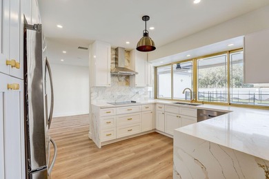 WOW! This incredible 5-bedroom, 3-bathroom pool home has been - photo 3