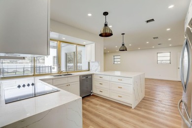 WOW! This incredible 5-bedroom, 3-bathroom pool home has been - photo 6