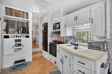 Check out this property! Super well kept RV with a large - photo 16