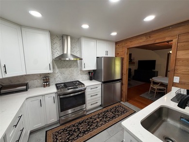 This tastefully updated two bedroom , two bath cabin is located - photo 16
