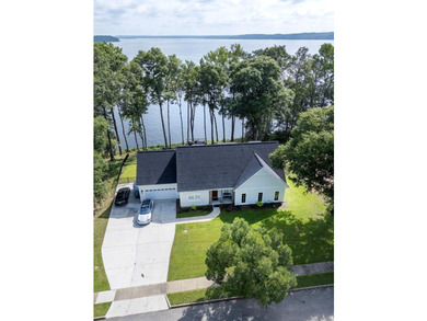 Welcome to luxury lakefront living in the highly sought-after - photo 1