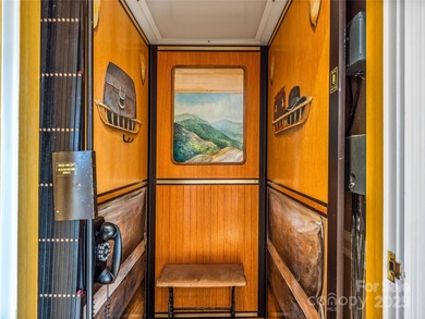 Commanding one of Asheville's most awe-inspiring mountain