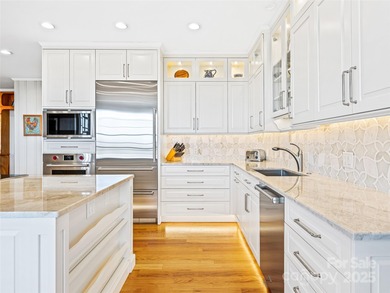 Commanding one of Asheville's most awe-inspiring mountain