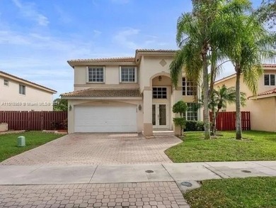 Beautifully maintained two-story waterfront home located in the - photo 1