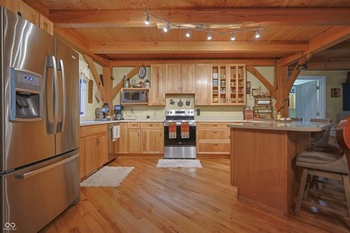 Custom red oak timber-frame home with Lake Monroe views, located - photo 22