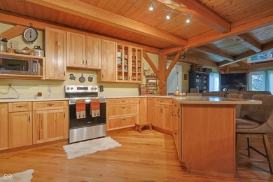 Custom red oak timber-frame home with Lake Monroe views, located - photo 24