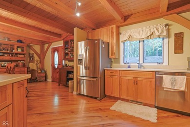 Custom red oak timber-frame home with Lake Monroe views, located - photo 26
