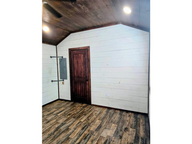 This charming tiny home at Lake Holbrook in Mineola, TX, blends - photo 7