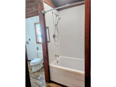 This charming tiny home at Lake Holbrook in Mineola, TX, blends - photo 8