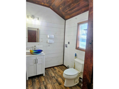 This charming tiny home at Lake Holbrook in Mineola, TX, blends - photo 9